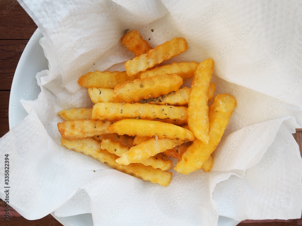 fish and chips french fries serve in tissue paper absorb oil lean Stock Photo Adobe Stock