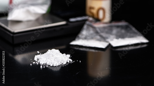 Portion of Cocaine on a dark plate (close-up)