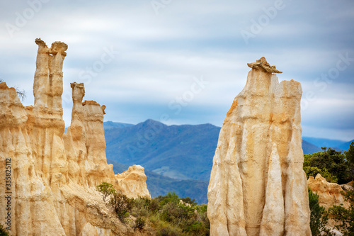 Natural chimneys made up of columns of soft rock, eroded by rain in Les Orgues d'illes sur Tet. Languedoc Roussillon, France photo