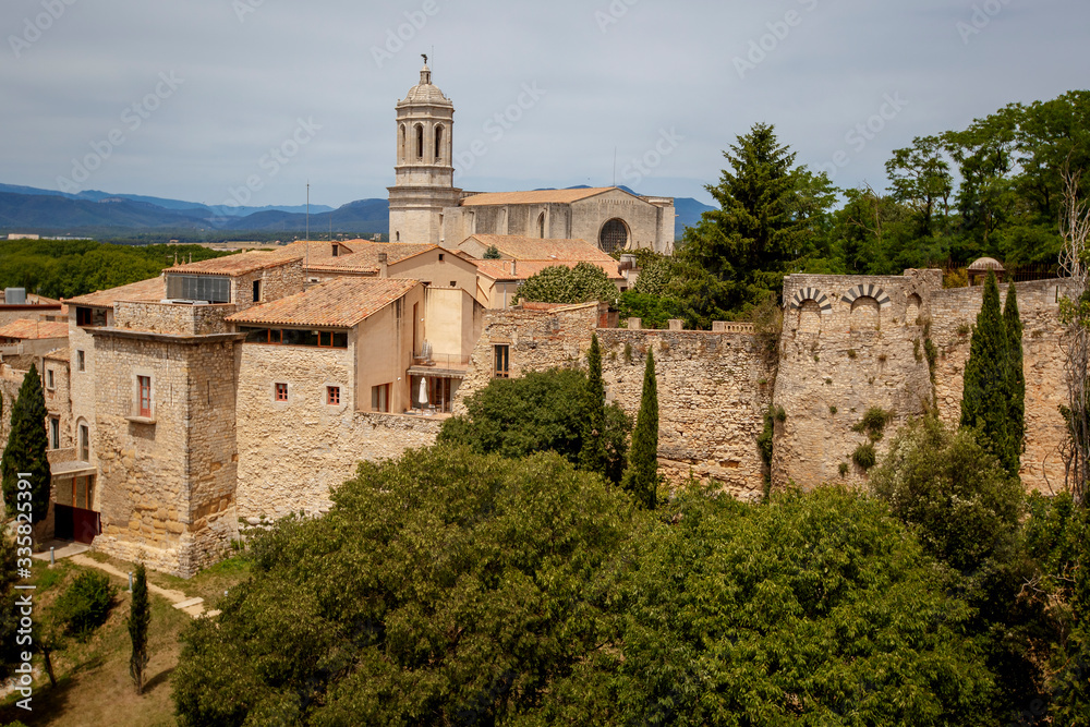 Girona old city wall fortification, venerable 9th-century city walls with walkways, towers and scenic points of the area, city views of Girona, Catalonia, Spain