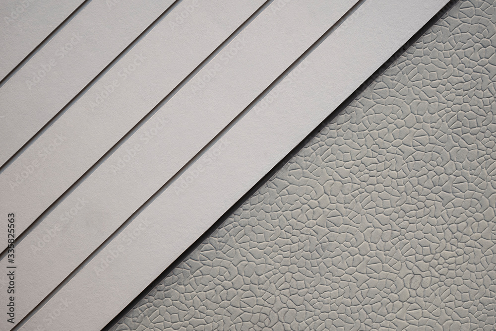Diagonal view of white artificial wood with stone pattern of gray