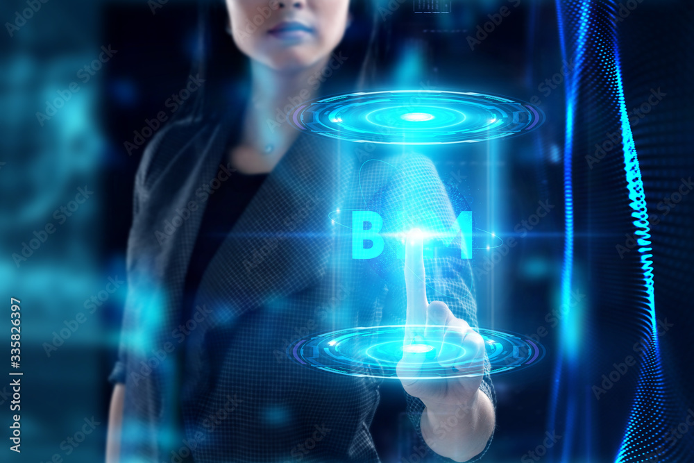 Fototapeta premium Business, Technology, Internet and network concept. Young businessman working on a virtual screen of the future and sees the inscription: BIM