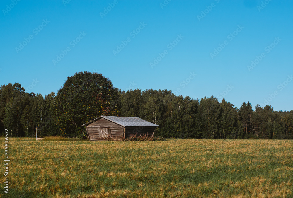 Fototapeta premium Lonely barn by the road in the Sweden