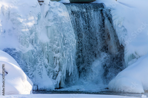 winter waterfall in captivity of ice and snow