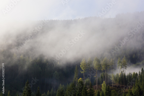 Austrian alpine landscape scenery at dawn with clearing fog
