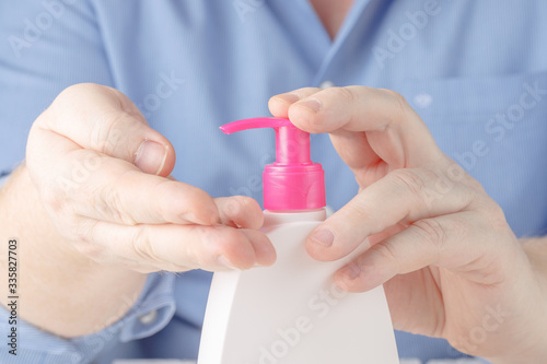 elderly people using alcohol antiseptic gel prevent infection outbreak of Covid-19 senior woman washing hand with hand sanitizer to avoid contaminating with Coronavirus