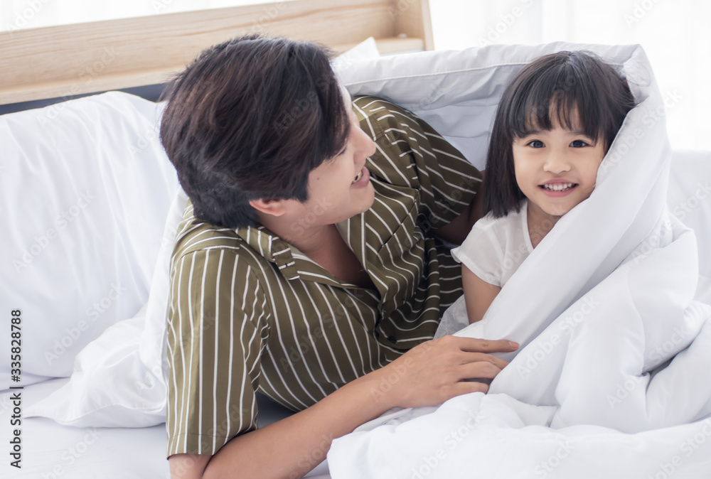 Fototapeta premium Dad and daughter are playing together