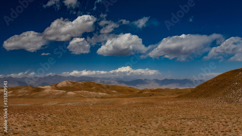 Scenic landscape of hilly terrain. in Kyrgyzstan. The Trans-Alay Range. Pamir Mountain System. Cloudy day.