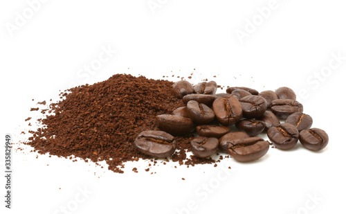 Ground coffee and coffee beans isolated on white background.