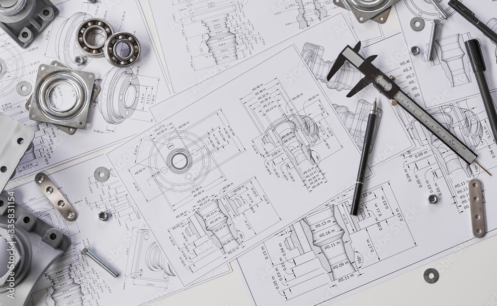 © Chaosamran_Studio - Engineer technician designing drawings mechanical parts engineering Engine.manufacturing factory Industry Industrial work project blueprints measuring bearings caliper tools © Chaosamran_Studio - Engineer technician designing drawings mechanical parts engineering Engine.manufacturing factory Industry Industrial work project blueprints measuring bearings caliper tools