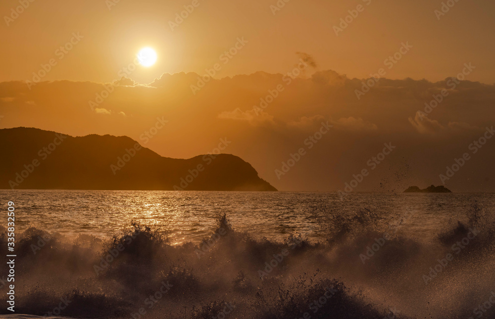 Morning sun and wave on the sea
