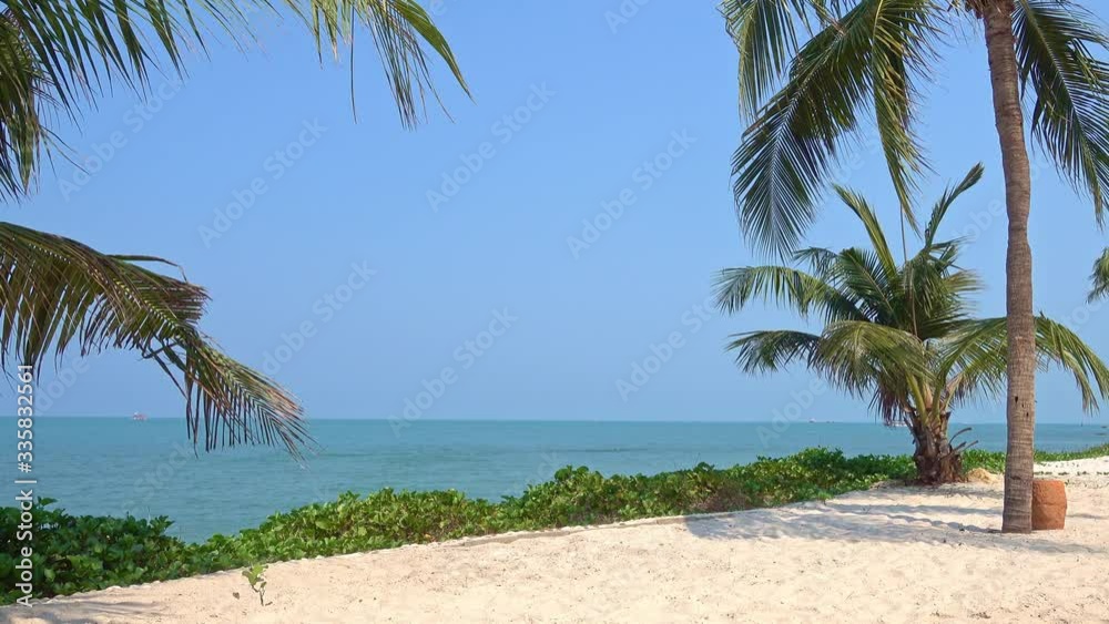 Tropical beach with coconut palms seaside in Thailand