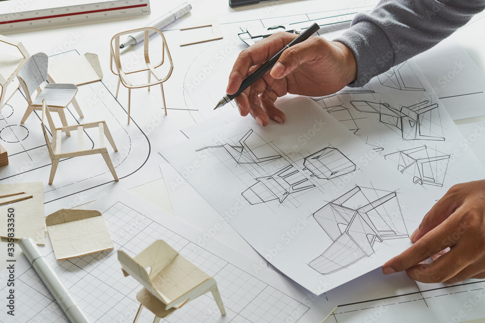 Designer sketching drawing design development product plan draft chair armchair Wingback Interior furniture prototype manufacturing production. designer studio concept . Designer sketching drawing design development product plan draft chair armchair Wingback Interior furniture prototype manufacturing production. designer studio concept .