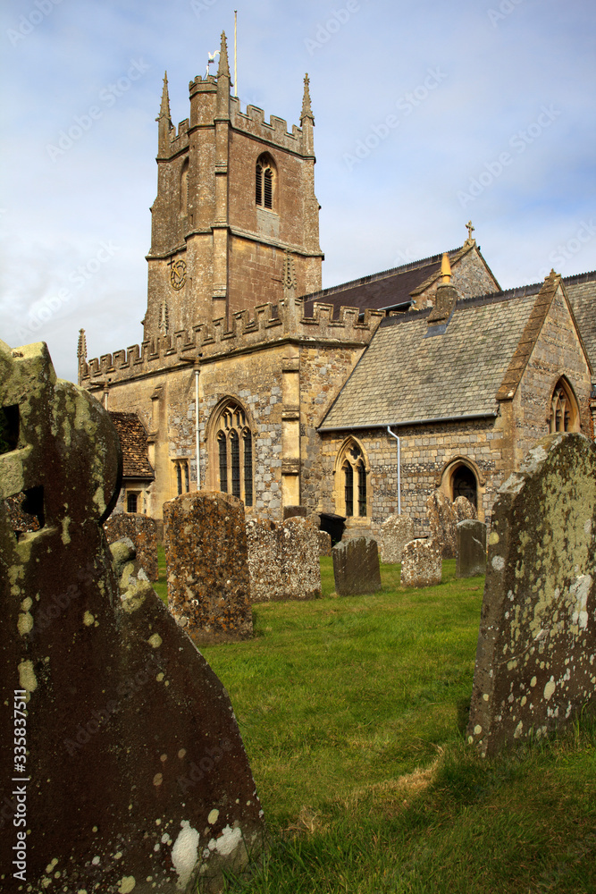 Avebury (England), UK - August 05, 2015: The church and cemetery in Avebury village, Wiltshire , England, United Kingdom.