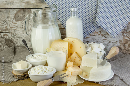 Fresh dairy products on a wooden table.