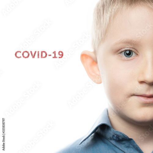 preschool boy close-up face on a white background photo