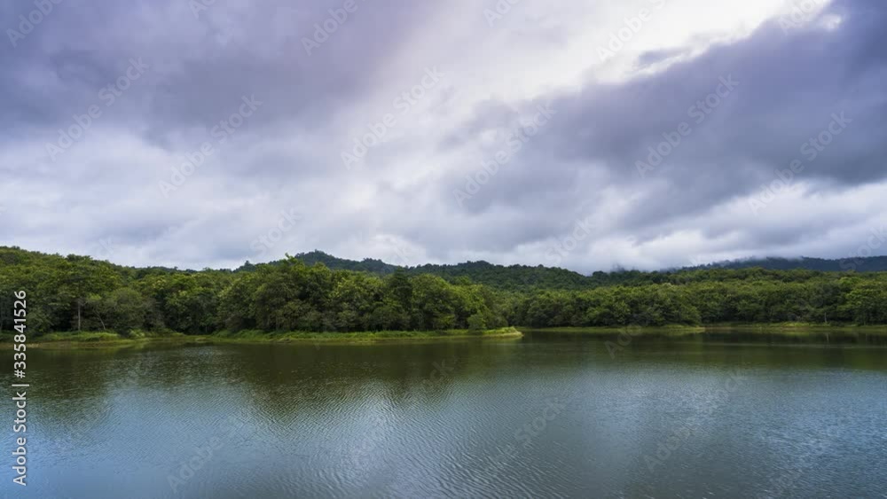Lake with reflection mountain under cloudy sky location as south of thailand Lake with reflection mountain under cloudy sky location as south of thailand