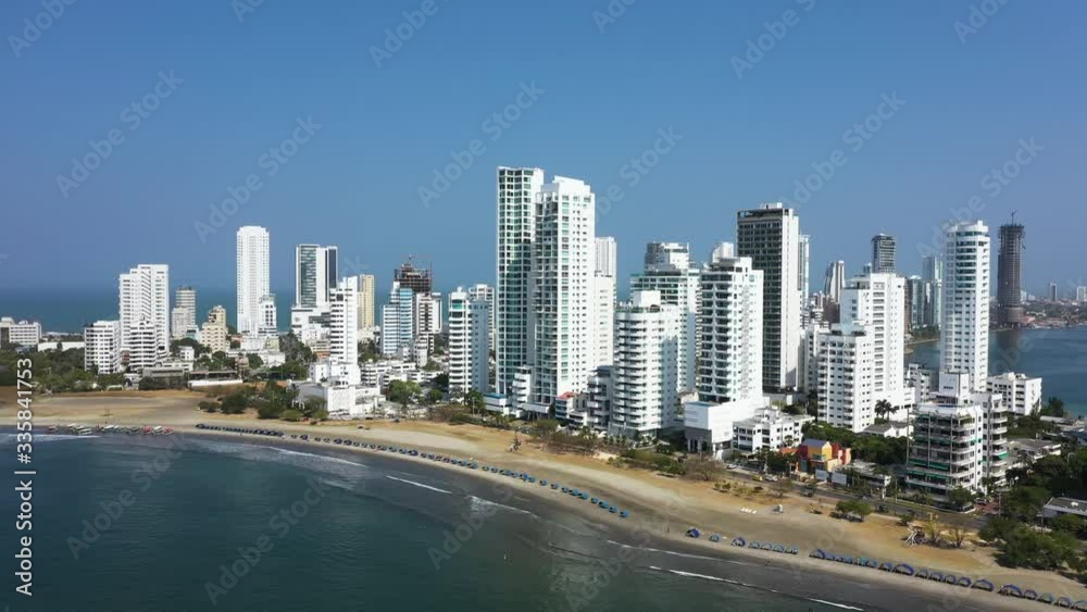 Aerial view of a modern and industrial city in Latin America. Movement of vehicles on the streets in the coastal zone of the city. Vertical pan from left to right. Aerial view of a modern and industrial city in Latin America. Movement of vehicles on the streets in the coastal zone of the city. Vertical pan from left to right.