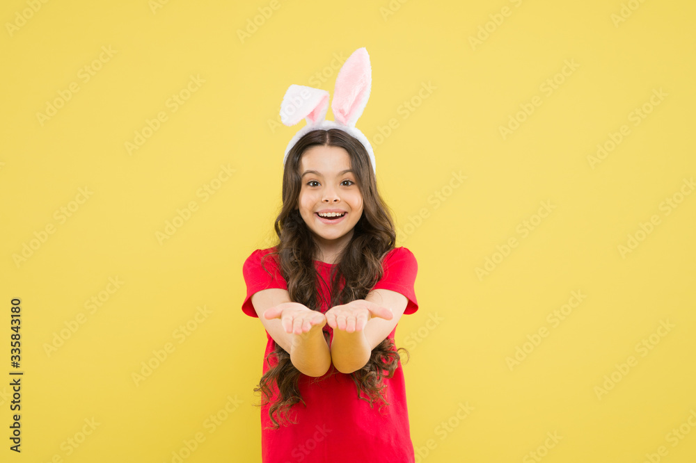 Charismatic baby advertising easter topic. Look here. Little child celebrate Easter. Small child Easter style. Bunny child. Girl child wear rabbit ears. Spring season. Holiday celebration