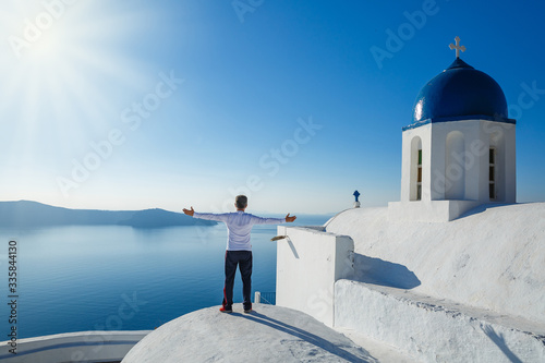 Man enjoys life traveling around the island of Santorini
