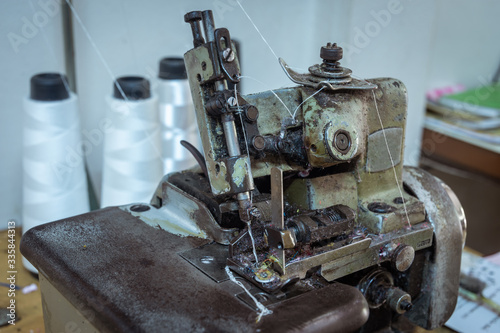 Sewing machine on table in workshop