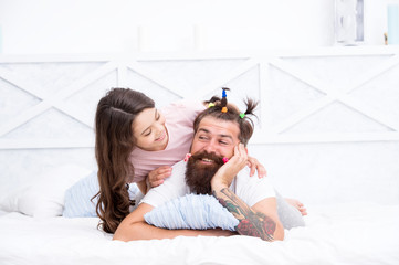 Family traditions. Fathers day with daughter at home. Daughter creating fathers hair. Handsome father with little girl. Happy father and daughter. little girl love her daddy. happy fathers day