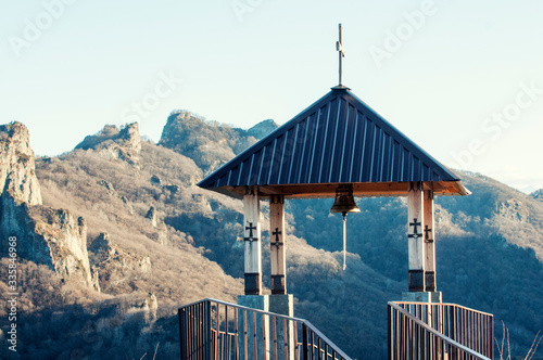 small wooden gazebo high in the mountains, Christian cross roof photo