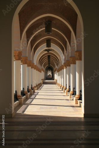 walk way lined by ornamental columns 