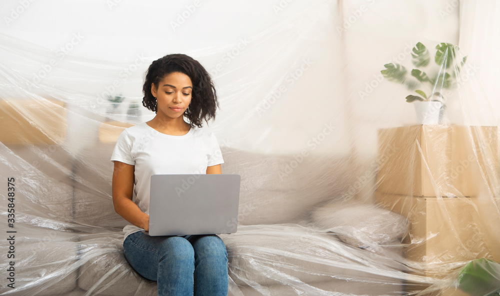 African american woman looking for ideas on internet African american woman looking for ideas on internet