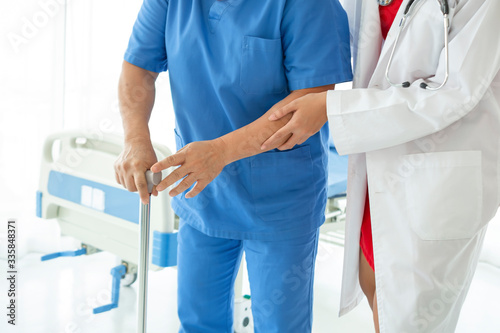 Asian doctor having checkup for a senior patient taken by soft focus technique