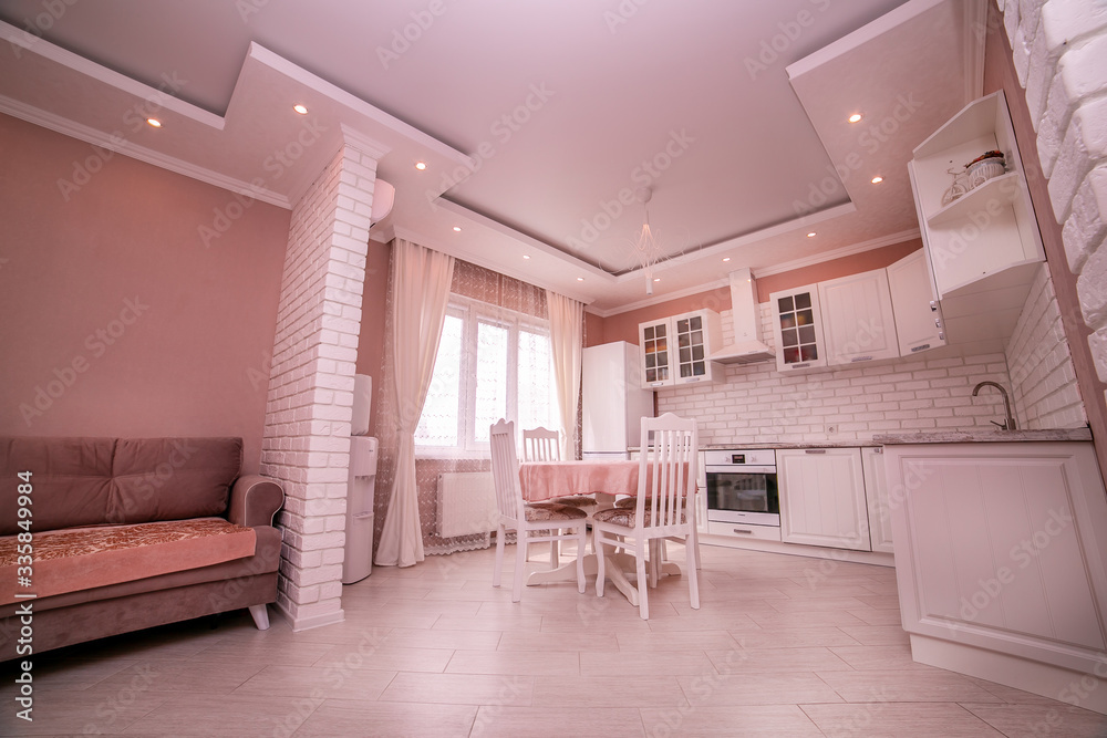Fototapeta premium Kitchen interior the room, modern kitchen, a kitchen background, the concept of healthy food, an interior of modern kitchen in beige, brown and white tones with a white brick