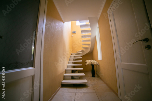Stairs leading to the upper  low level. Interior design.