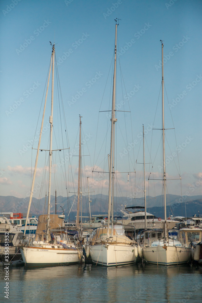 marina, yachts are on the water, sails are lowered