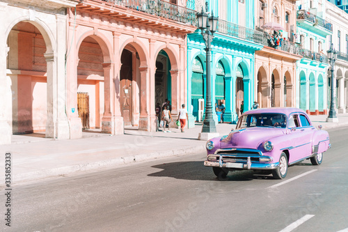 View of yellow classic vintage car in Old Havana, Cuba © travnikovstudio