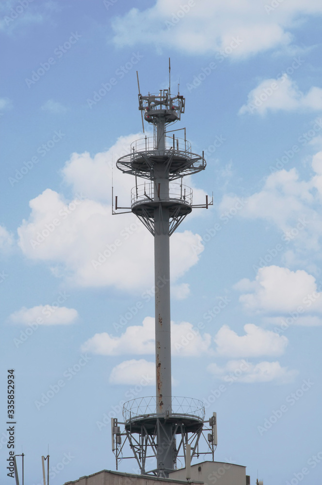 Cell tower closeup against a white sky. Cell tower closeup against a white sky.