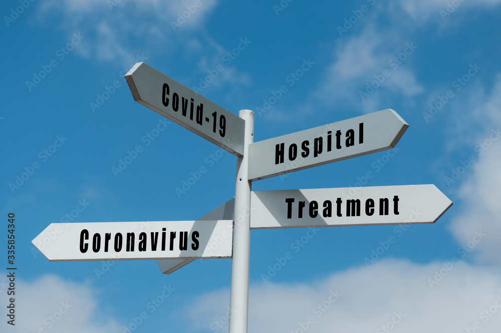 Concept direction panels on blue sky background - Covid -19 and treatment Concept direction panels on blue sky background - Covid -19 and treatment