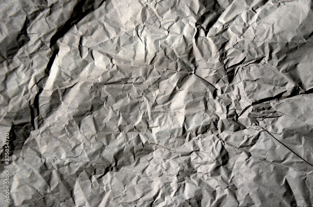 crumpled paper texture. gray background, copy space. crumpled paper texture. gray background, copy space.
