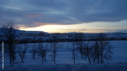 landscape in Sweden in winter during sunset
