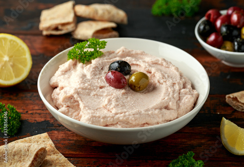 Taramasalata dip with pita bread and olives photo