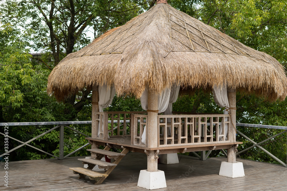 Garden furniture made of natural materials, thatched roof.