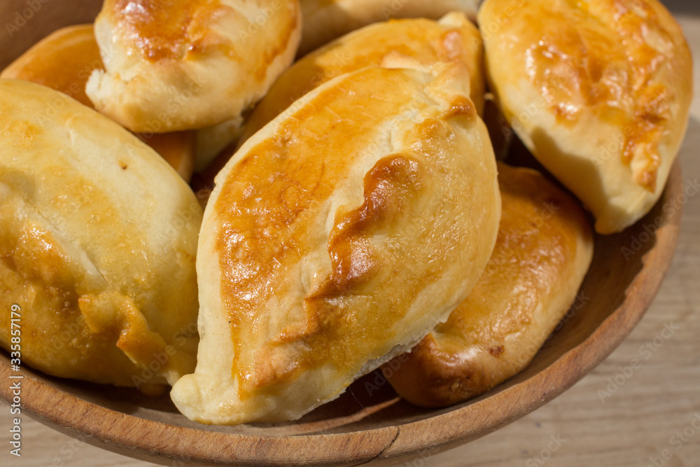 Baked cakes. Yeast baking. Pies with meat, cabbage and mushrooms. Homemade food. Slavic cuisine. Delicious pastries. Ruddy snack. Flour product. Bake in the oven. Junk food. Baked cakes. Yeast baking. Pies with meat, cabbage and mushrooms. Homemade food. Slavic cuisine. Delicious pastries. Ruddy snack. Flour product. Bake in the oven. Junk food.
