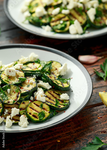 Warm salad with grilled zucchini, garlic and herbs