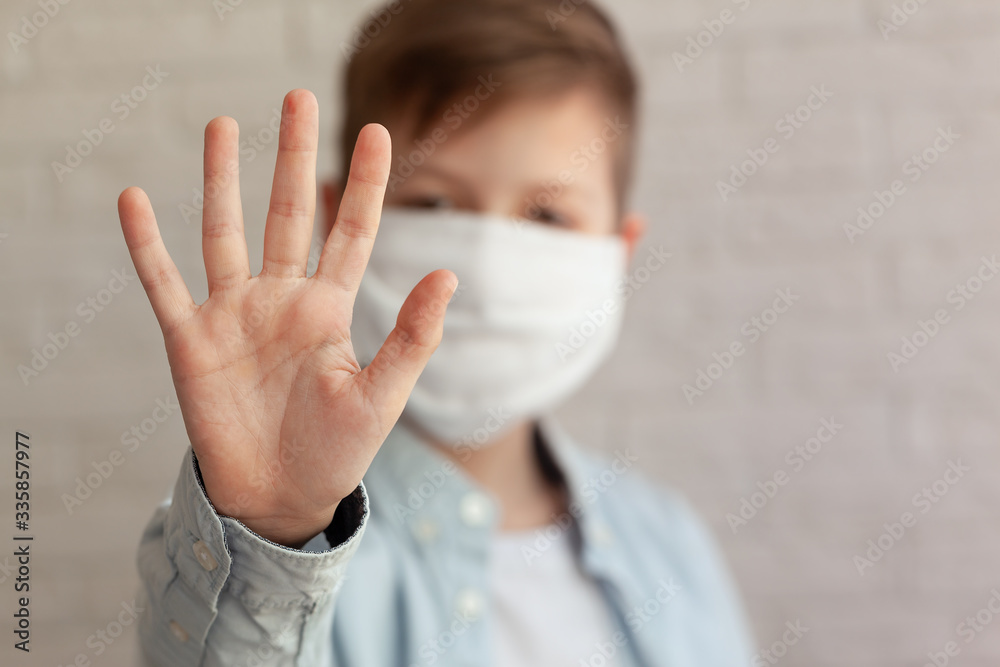 Plakat Little kid wearing mask for protect and show stop hands gesture for stop corona virus outbreak.