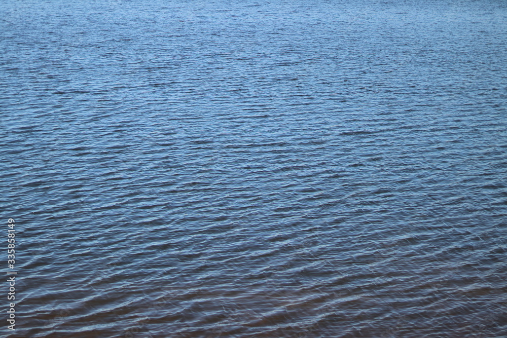 Blue lake waves in spring.