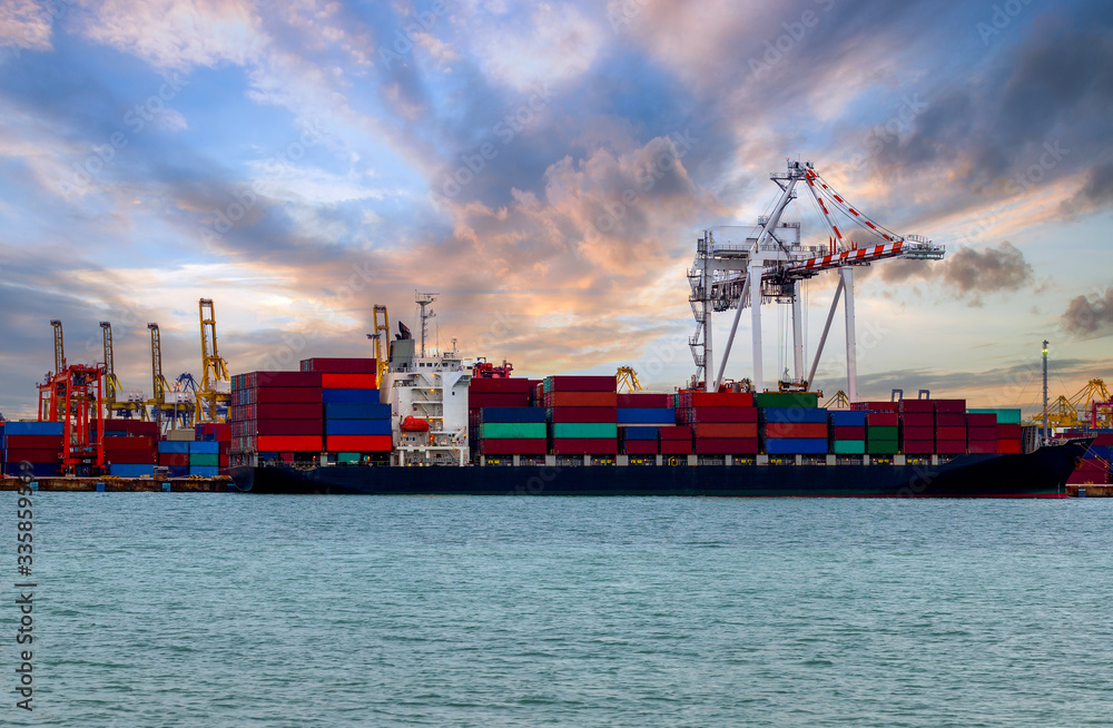 Fototapeta premium Logistics and transportation of container ships, transporting goods with bridges, cranes working in the shipyard at sunrise, export and import, the logistics, transportation and freight industry, look