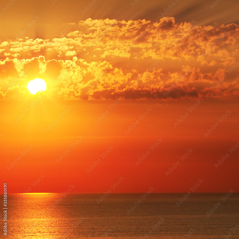 Bright sunrise over the sea. The concept is travel.