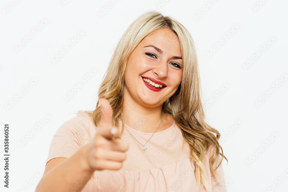 studio portrait of a beautiful girl pointing to the camera studio portrait of a beautiful girl pointing to the camera
