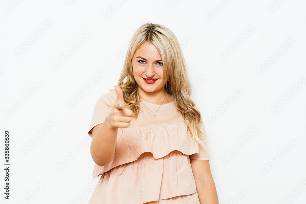 studio portrait of a beautiful girl pointing to the camera studio portrait of a beautiful girl pointing to the camera