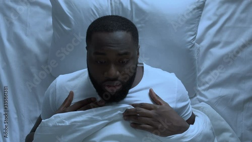 Wallpaper Mural Anxious man suddenly waking up suffering from nightmare, stressful life, topview Torontodigital.ca