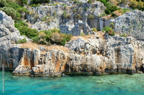 Weathered ruins of famous ancient underwater town Sunken City on Kekova island  in mediterranean coastline of Antalya province Turkey.